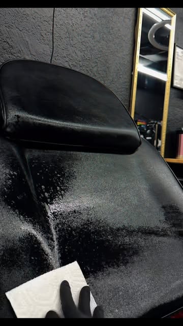 The tattoo chair at the studio, freshly wrapped